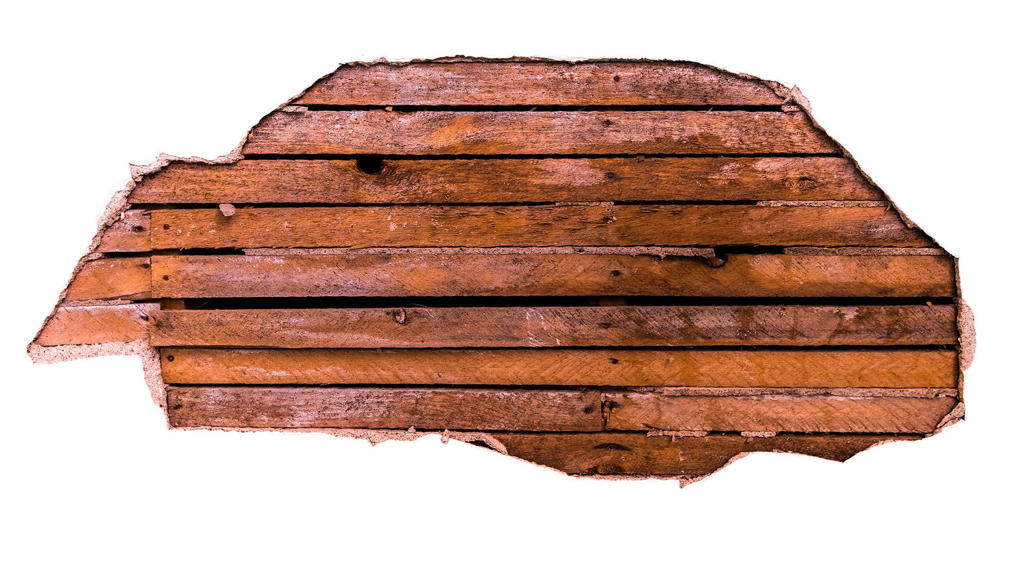 Wood and plaster on a wall.