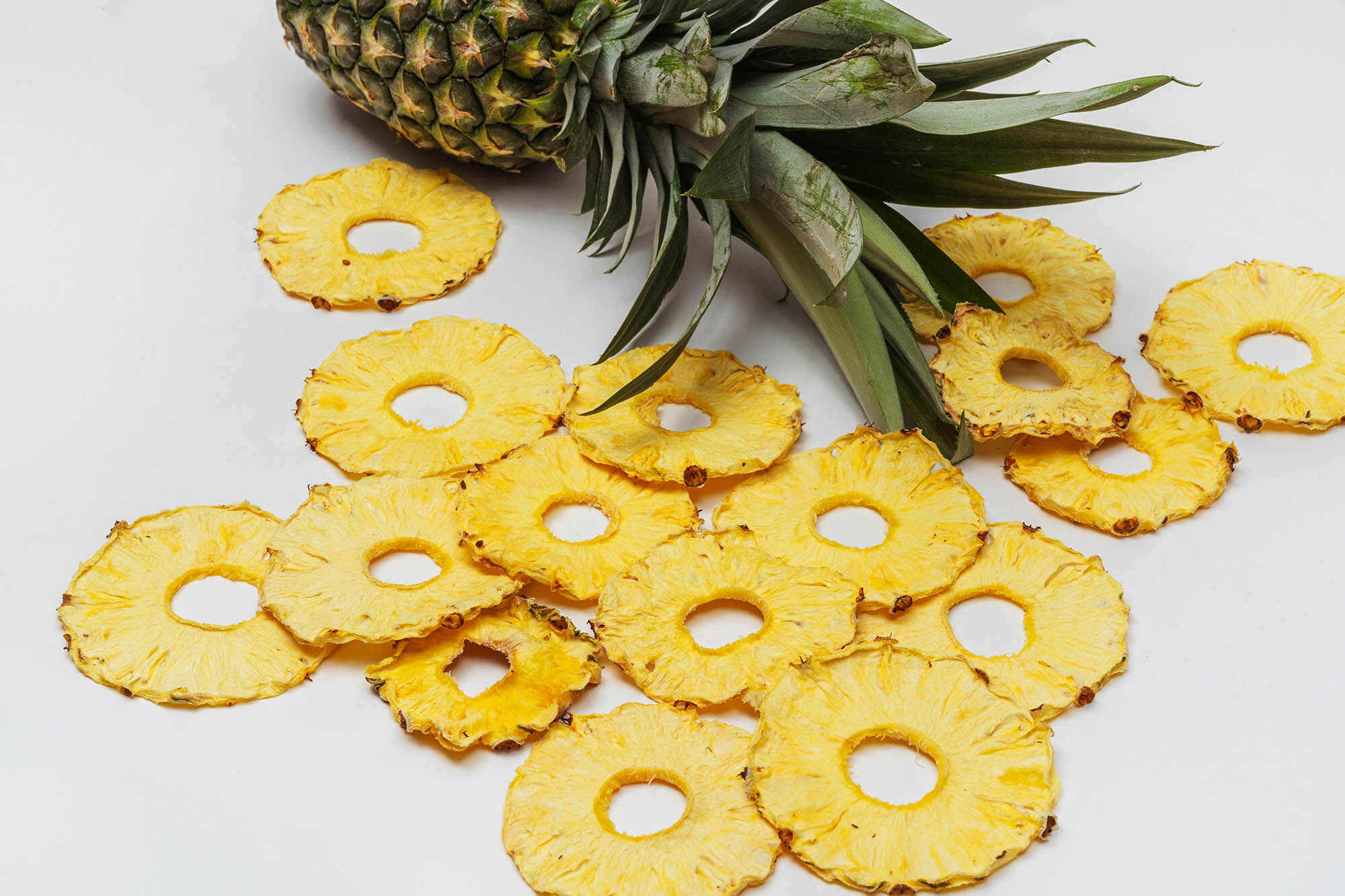 Pineapple and dried pineapple slices.