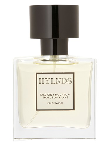 Pale grey mountain small black lake