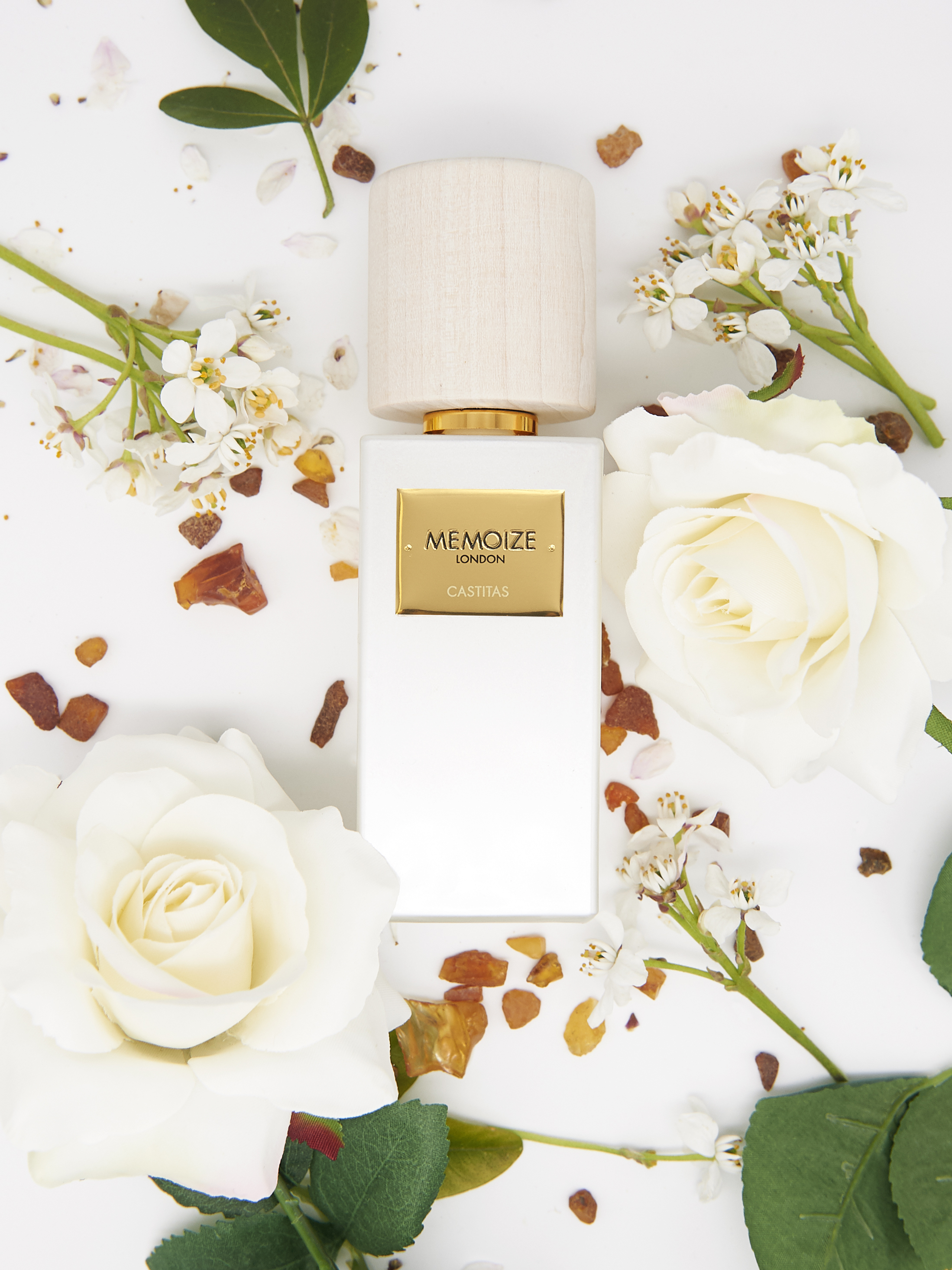 memoize london castitas bottle amidst white flowers