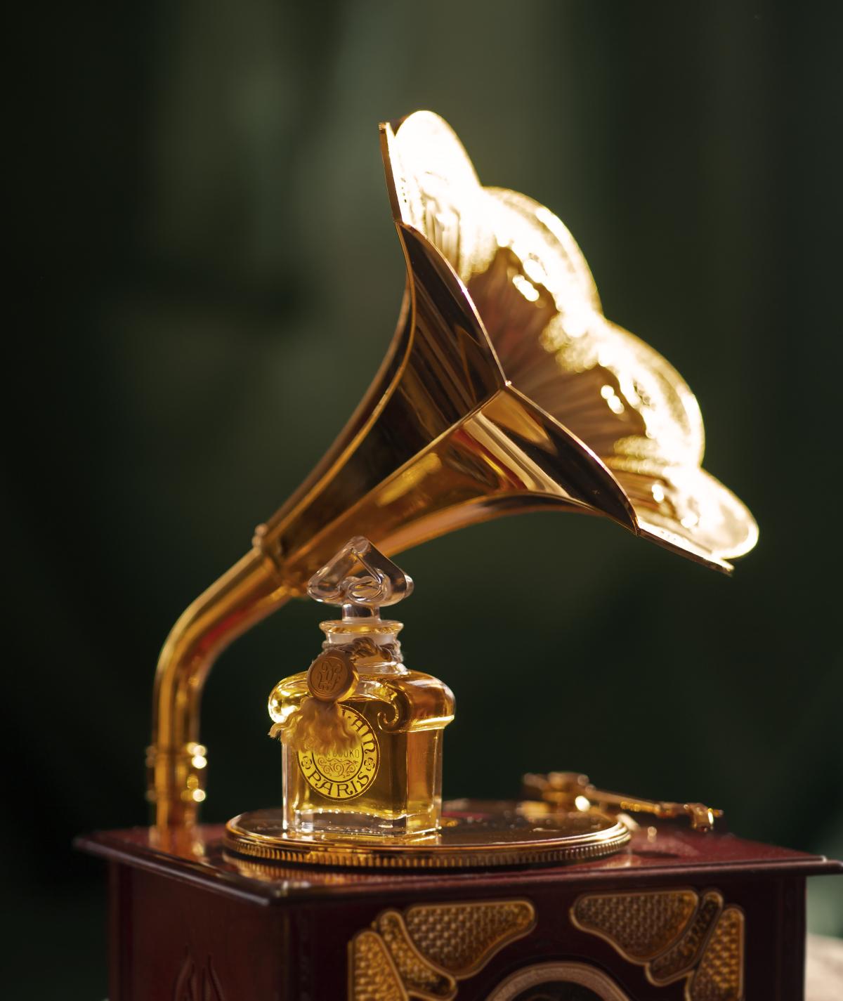 Guerlain quadrilobe bottle on gramophone