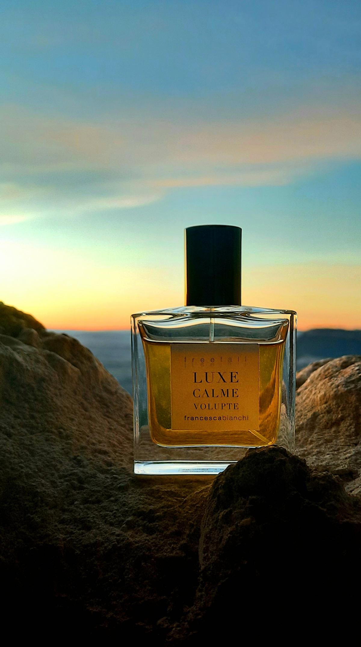 Francesca Bianchi Luxe Calme Volupte bottle with sunset background Fragram photo