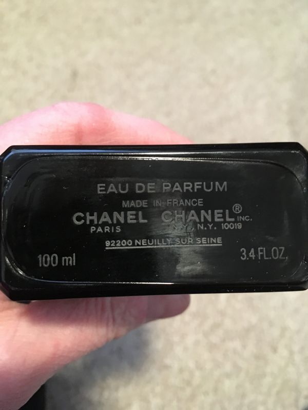 Are there real Chanel Coco Noirs with embossed words at the bottom
